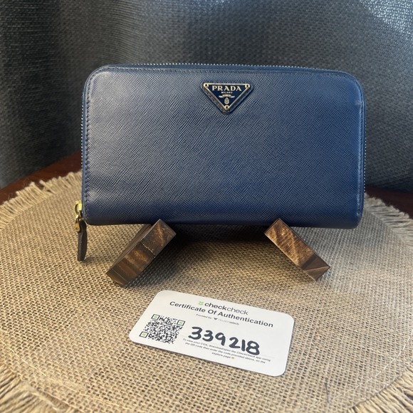 Prada Handbags - Authentic PRADA $1,000 Saffiano Blue Leather Round Zip Long Wallet COA Included